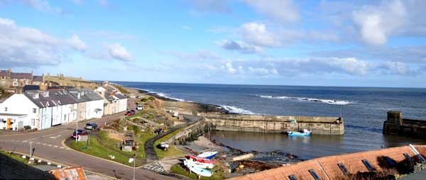 Craster harbour looking north to Dunstanburgh Castle